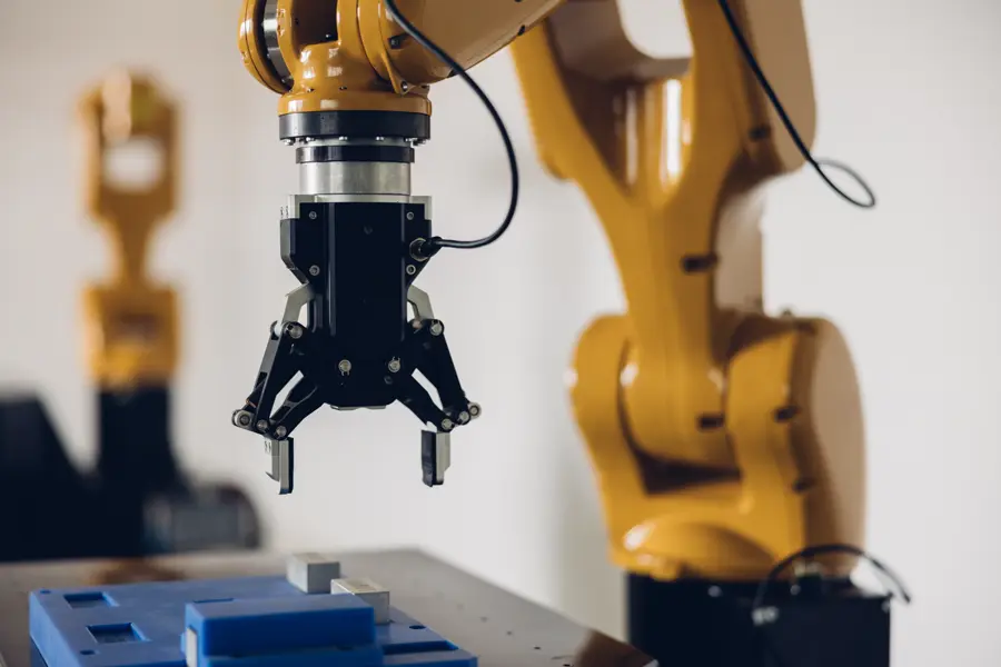 Industrial robotic arm handling material with precision