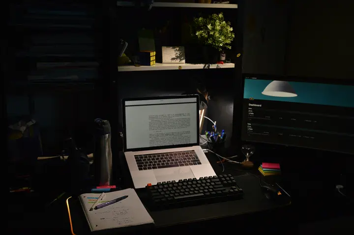 Focused desk setup glowing at night